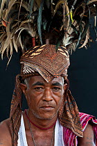 Portrait of East Timorese man in traditional clothing, Maubara, East Timor, August 2010.