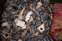 Plastic bottles and other rubbish in a creek in Dili, East Timor, August 2010