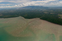Aerial view of Southern Palawan coast showing strong heavy siltation, the result of deforestation, April 2010.
