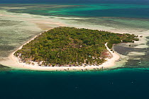 Aerial of white sandy beach island resort, Palawan, Philippines, April 2010.