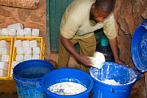 Mixing milk for the elephants at David Sheldrick Wildlife Trust Nairobi Elephant Nursery, Kenya, August 2008.