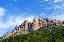Capo d'Orto crags, the highest coastal peaks in Corsica, rising to 1264m, with Mediterranean forest and maquis scrub around red granite cliffs. A UNESCO World Heritage coastal / marine site within Cor...
