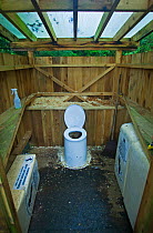A toilet cubicle in a wooden shelter. The West Coast Trail, Pacific Rim National Park, Vancouver Island, Canada, September 2010.