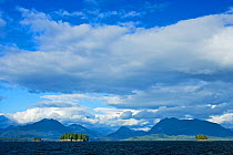 Clouds above coastal mountains and islands. The Broken Group Islands, Barkley Sound, Vancouver Island, Canada, September 2009.