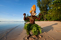 Man dancing in a Tatanua Mask, an image of the soul of the deceased. When a person dies, by Malagan tradition people dance in the shallow waters to try to drive evil spirits or taboos of the dead away...