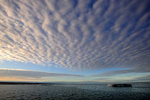 Clouds in a ripple pattern over melting icepack. Foxe Basin, Nunavut, Canada, July 2011.