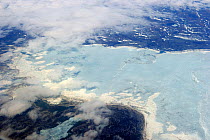 Aerial view of land and icepack in spring. Baffin Island, Nunavut, Canada, April 2009.