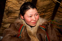 Puyni, a young Nenets woman, at a reindeer herder's camp near Tambey, Yamal Peninsula, Western Siberia, Russia, March 2011