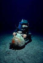 Diver discovers Roman Amphora on sea floor. Ustica Island, Italy, Mediterranean Sea Model released.