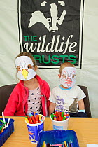 Children making Osprey masks at Lyndon Visitor Centre, Rutland Water, Rutland, UK, April 2011