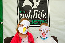 Children making Osprey masks at Lyndon Visitor Centre, Rutland Water, Rutland, UK, April 2011
