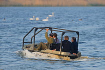 Reserve Manager Tim Appleton, Osprey Project Manager Tim Mackrill, Field Officer John Wright and Assistant Warden Lloyd Park check nesting islands and rafts at the Anglian Birdwatching Centre using an...