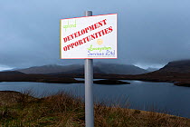 Spoof development sign, Assynt Uplands looking towards Stac Pollaidh, Sutherland, Highlands, Scotland, UK, January 2011