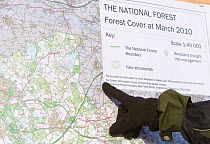 Boy pointing to map of The National Forest, Moira, Derbyshire, UK, November 2010