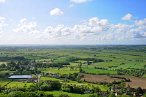 View of the Somerset countryside, including a farming reservior, looking southeast from Glastonbury Tor. Somerset, England, May.