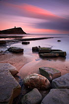 Kimmeridge Bay with Clavell Tower at dusk. Jurassic Coast, Dorset, England, March 2010.