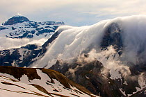 Clouds flowing over the north face of the Monte Perdido mountains. Ordesa Monte Perdido National Park, Pyrenees, Aragon, Spain, May 2011.