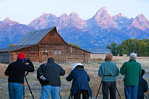 Photographers photographing Moulton Barn, rear view, Grand Teton National Park, Wyoming, USA, September 2008
