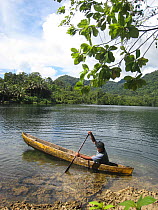 Young boy in canoe, Russel Islands, Solomon Islands, Melanesia, May 2008.