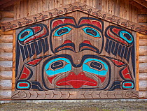 Tlingit (Southeast Alaskan Native American) carving on the side of the Clan House. Bight Totem State Park, Ketchikan, Alaska, July 2011.