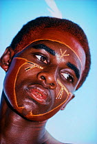 Young El Molo warrior with his face painted for a tribal dance, Lake Turkana, Kenya, April 2008.  Model released.