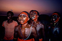 El Molo warriors and tribal people dance during the Hippopotamus Ceremony, Lake Turkana, Kenya, April 2008.