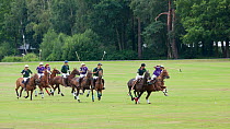Polo playing, two teams of four compete in The Heritage Cup, Royal Military Academy Sandhurst,  Surrey, UK, August 2011