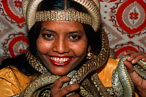 Woman Snake Charmer holding cobras. Jaipur- India. Model Released- Aisha Khan