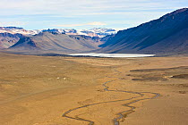Aerial view of the River Onyx, the only running river in Antarctica, Dry Valleys, December 2009. Taken on location for the BBC series, Frozen Planet.