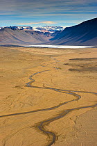 Aerial view of the River Onyx, the only running river in Antarctica, Dry Valleys, December 2009. Taken on location for the BBC series, Frozen Planet.