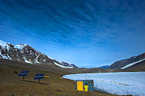 Solar panels and hut at Lake Hoare Research Centre, Dry Valleys, Antarctica, December 2009. Taken on location for the BBC series, Frozen Planet.