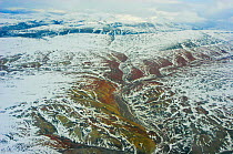 Aerial view of tundra landscape with light covering of snow, Ellesmere Island, Nunavut, Canada, June 2008. Taken on location for the BBC series, Frozen Planet.