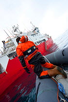 Film crew coming alongside Royal Navy ship, HMS Endurance, Antarctica, November 2008, Taken on location for the BBC series, Frozen Planet.