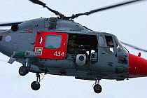 Royal navy helicopter from HMS Endurance in flight, Antarctica. Taken on location for the BBC series, Frozen Planet.