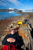Field Assistant, Jason Roberts, sleeping during filming of Frozen Planet, Svalbard, Spitzbergen, Norway, July 2009, Taken on location for the BBC series, Frozen Planet.