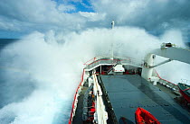 Royal Navy ship, HMS Endurance, crashing through the waves in the south atlantic ocean, Antarctica, November 2009. Taken on location for the BBC series, Frozen Planet.