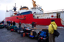 The Frozen Planet team waiting to board the United States Coastguard Cutter 'Healy' in Dutch Harbour, Alaska, USA, on their way to film Spectacled eider ducks in the Bering Sea, March 2008. Taken on l...