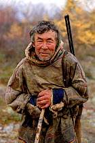 Elderly Nenets man out hunting wild Reindeer in Autumn. Yamal, Western Siberia, Russia, 2001. 40 BELOW bookplate.