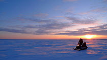 Travelling across Northern Canada on skidoo, Arctic circle, Taken on location for BBC Frozen Planet series, 2009