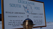Geographical South Pole marker, Antarctica. Taken on location for BBC Frozen Planet series, 2009