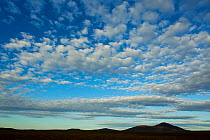 Clouds over silhouette of Ben Griam Beg, Forsinard, Flow Country, Sutherland, Scotland, UK, June 2011