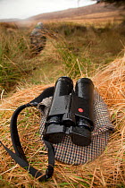 Deer stalker's binoculars and tweed hat / cap, Assynt Foundation, Glencansip Estate, Assynt, Sutherland, NW Scotland, UK, January 2011. Model released