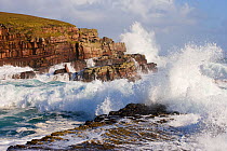 Waves crashing over rocks, coastline near Point of Stoer, Assynt, Sutherland, NW Scotland, UK, October. Did you know? 20 million people visit UK coastlines each year.