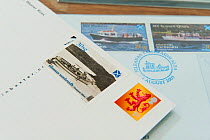 Local stamps in book at Tanera More post office and tea room, Coigach and Assynt, Sutherland, Scotland, UK, June 2011