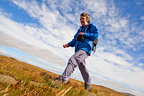 Walker on nature walk at RSPB Forsinard Flows, Flow country, Caithness, Highland, Scotland, UK, June 2011