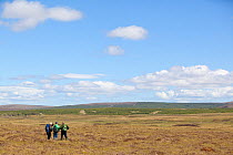 Family on nature walk at RSPB Forsinard Flows, Flow country, Caithness, Highland, Scotland, UK, June 2011
