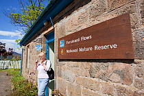 Woman at Visitor Centre at RSPB Forsinard Flows reserve, The Flow Country, Caithness, Highland, Scotland, UK, June 2011