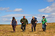 Family on guided walk with RSPB Volunteer, Forsinard Flows reserve, The Flow Country, Caithness, Highland, Scotland, UK, June 2011