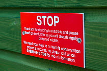 Stop sign on aviary as part of the East Scotland Sea Eagle reintroduction project, Fife, Scotland, UK, June 2011