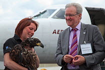 Claire Smith (RSPB) speaks to MSP Stewart Stevenson on arrival of Norwegian White tailed sea eagle chicks (Haliaeetus albicilla) at Edinburgh airport, part of the East Scotland Sea Eagle reintroductio...